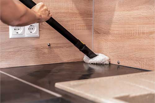 A professional from Easy Life Home Solutions providing residential floor cleaning in a Walnut Creek home