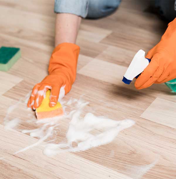A professional from Easy Life Home Solutions performing residential floor cleaning service in Walnut Creek for a spotless and renewed floor finish