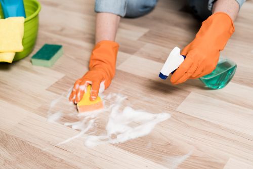 An expert from Easy Life Home Solutions cleaning a spot on a residential floor in Walnut Creek